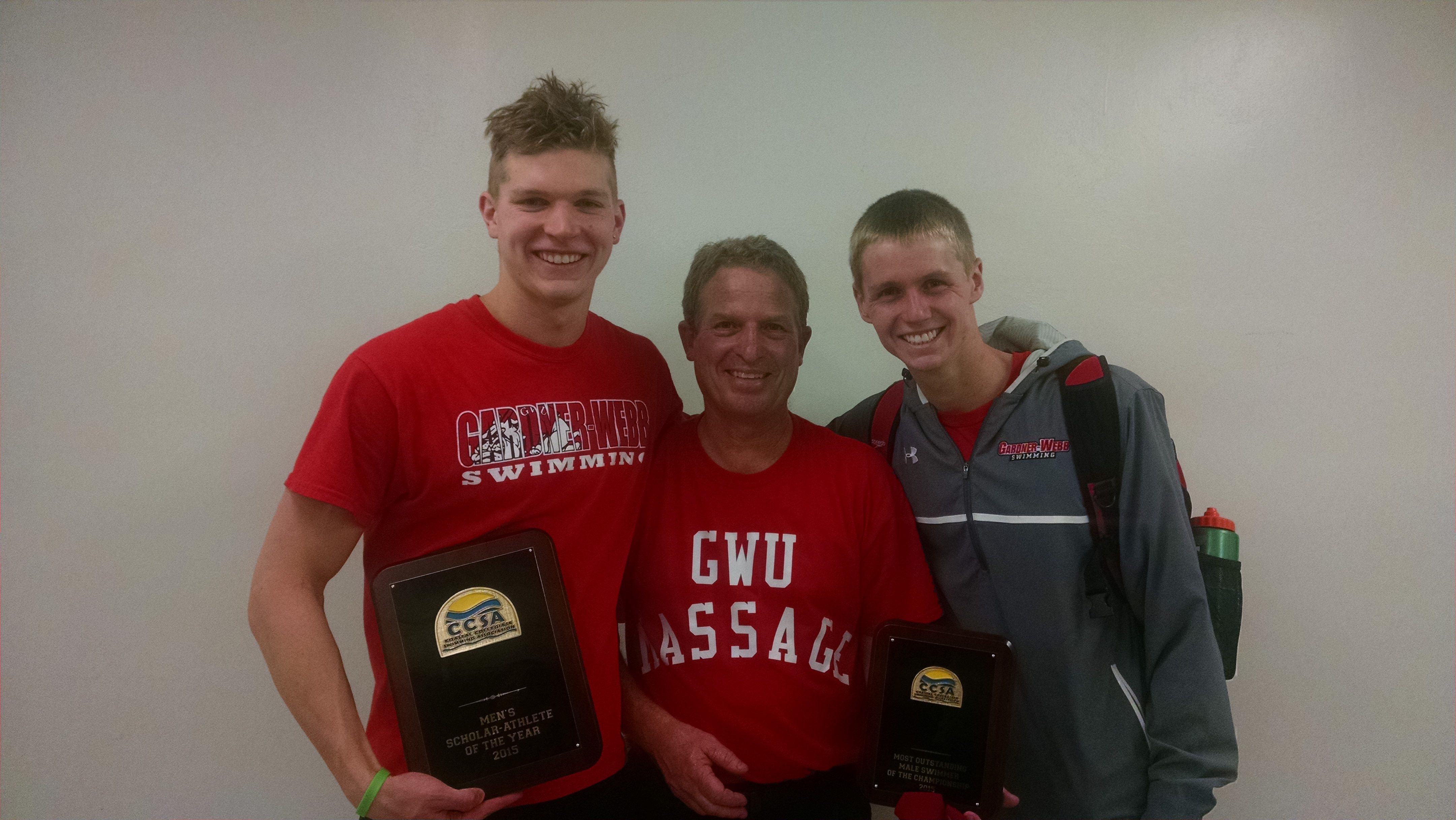 Jim and two Gardner-Webb Swimmers with 2 trophy plaques at 2015 CSSA swim finals